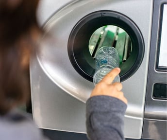 Woman participating in the Deposit Return Scheme